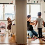 Mom and kids cleaning house