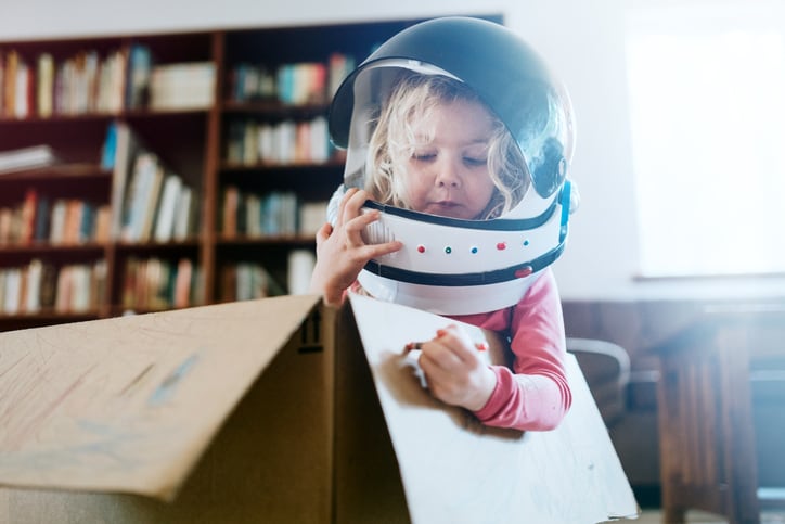 child playing astronaut