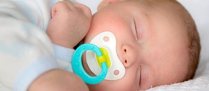 Newborn sleeping with store dummy