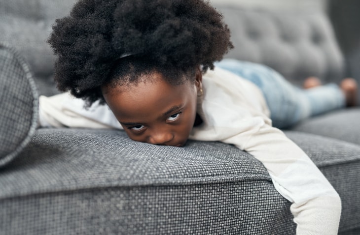 girl bored on couch